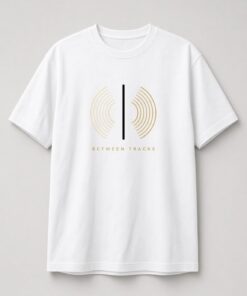 Popscene House Between Tracks Vinyl Groove Unisex T-Shirt in white with cream-to-gold vinyl groove lines split by a vertical line with BETWEEN TRACKS text
